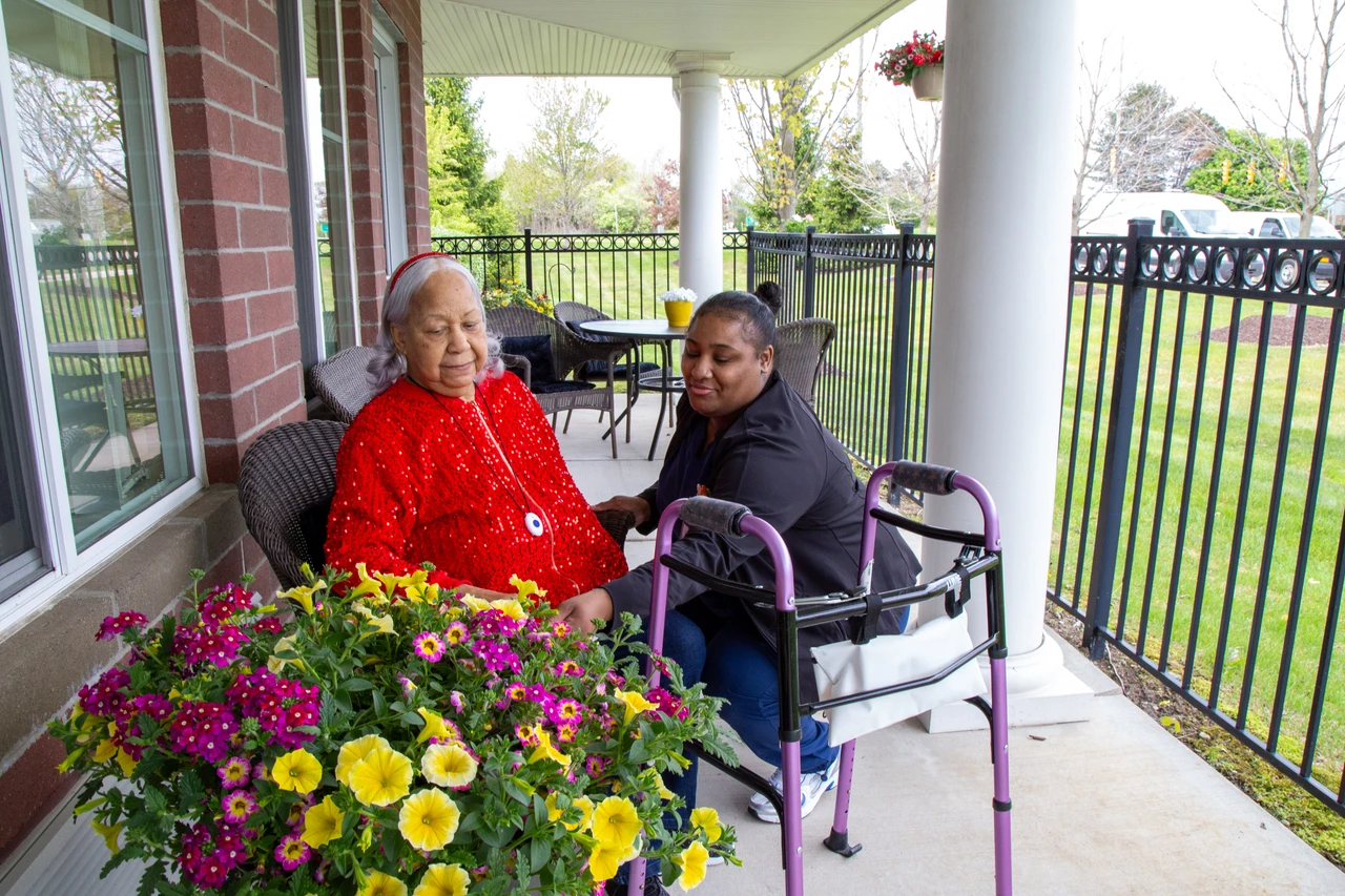 Resident and caregiver enjoying the Belmar porch