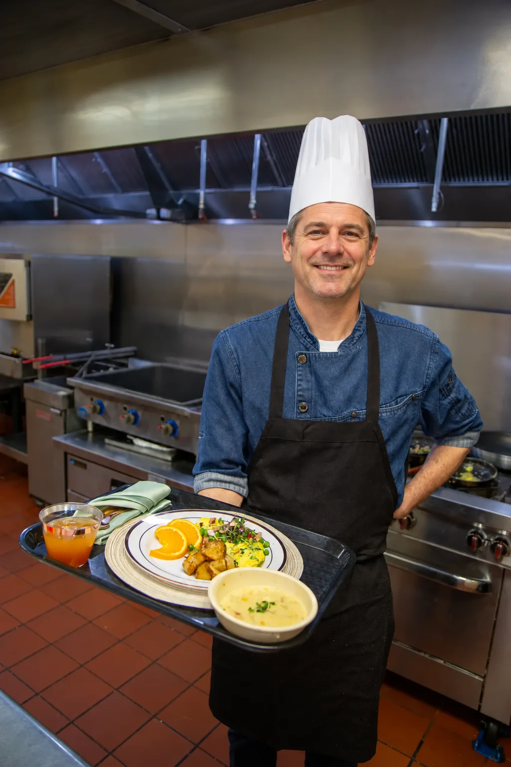 Chef presenting a freshly prepared meal